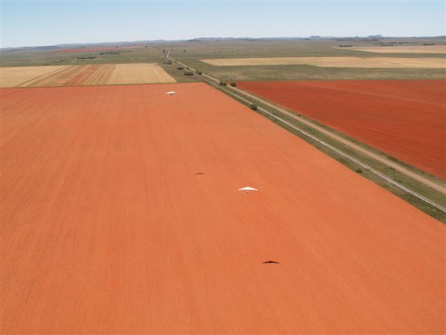 2 trikes over field.JPG